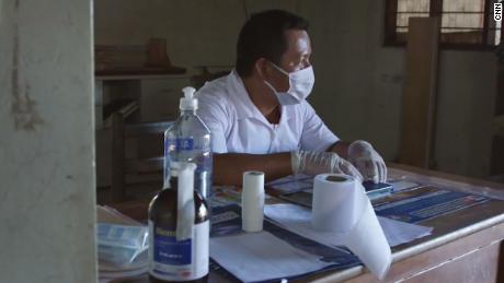 Elias Magin sits inside the clinic in Caimito.