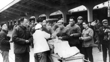 Chinese travelers buy their breakfast from a street vendor at Chunghow Railway Station in 1975. Premier Li Keqiang has suggested more street vendors could help fix a looming jobs crisis.
