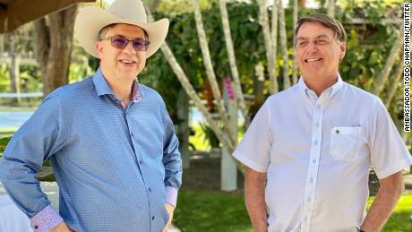 Bolsonaro attended a July 4th commemoration event with the US Ambassador to Brazil Todd Chapman on Saturday, according to a photo posted to the President&#39;s official Facebook page.
