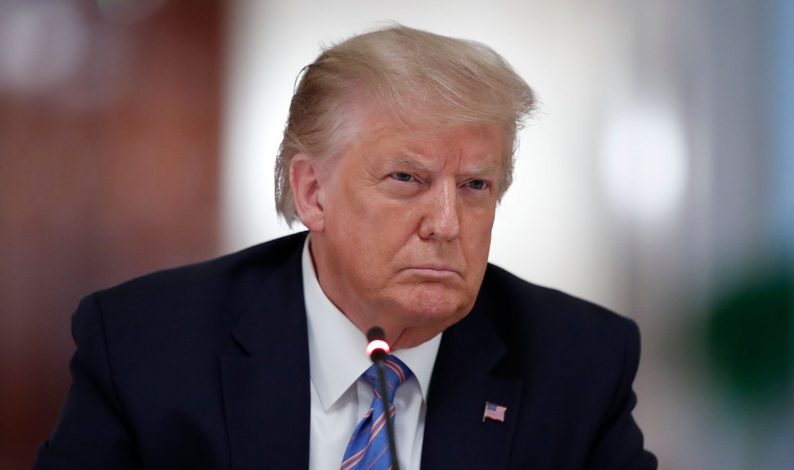 President Donald Trump listens during a "National Dialogue on Safely Reopening America's Schools," event at the White House on July 7 in Washington, DC.