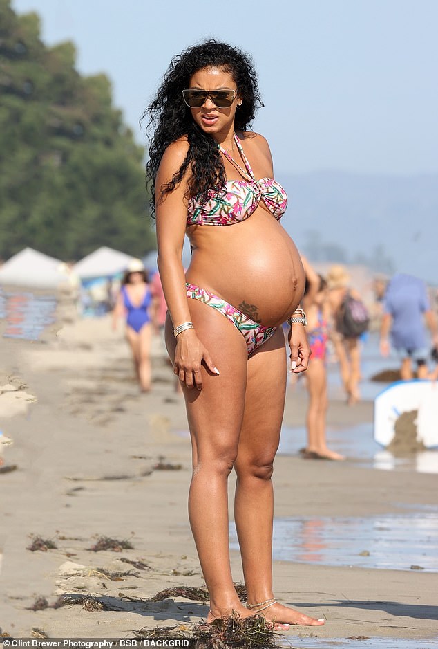 Babysitting: Meanwhile, Kevin's pregnant wife Eniko, 35, hung out on a nearby beach with their son Kenzo, two, and Kevin's daughter Heaven, 15, whom he shares with ex Torrei Hart