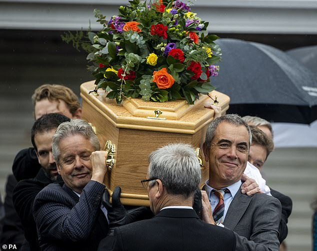 Northern Irish actor James Nesbitt (front, right) carries his father's casket in Coleraine, Northern Ireland, ahead of the funeral of his father, to be held at Downhill Burying Ground