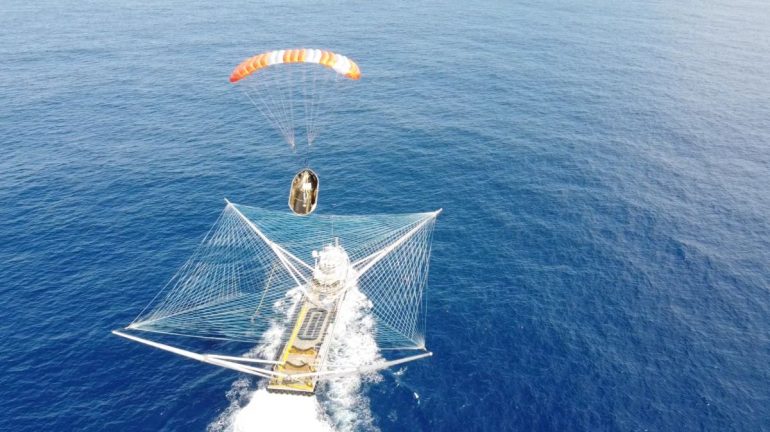 Watch SpaceX boat catch falling payload fairing in giant net (video)