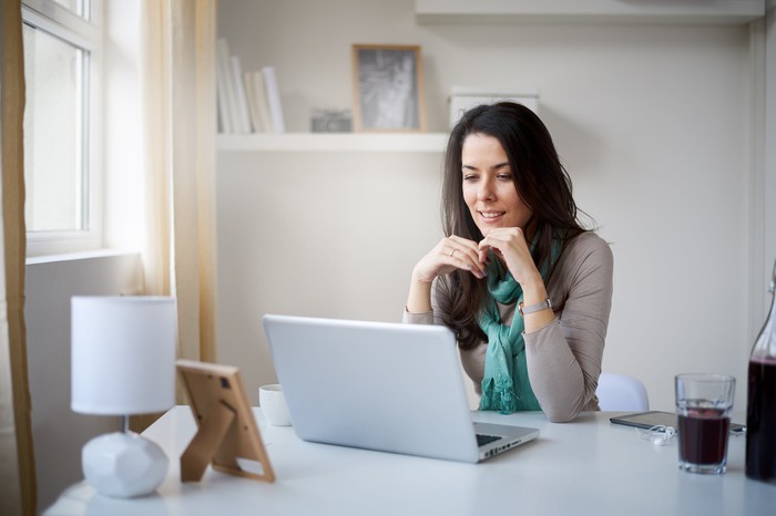 Someone sitting at home with a laptop. 