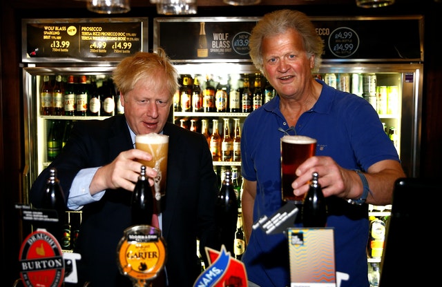 Happy Times for Boris Johnson and Tim Martin (Henry Nichols / PA)