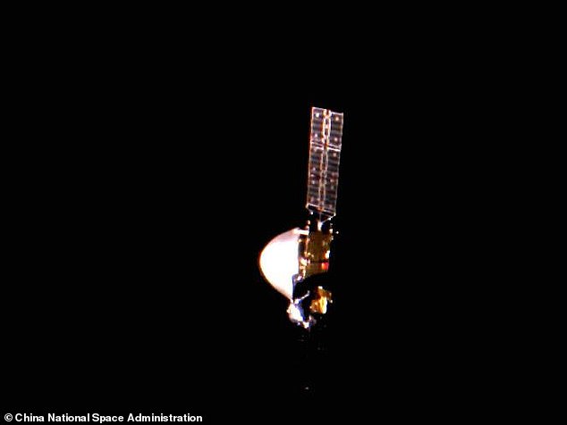 The probe, a gold orbiter and silver lander, appears to be shining in the darkness of the universe, indicating that China's largest space mission is still underway.
