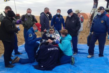 The trio, who had been on the space station for six months, return safely to Earth