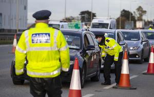 Guardoy at a checkpoint on the M7 motorway on the border of Dublin and Kildare on the first day of the Level 5 restrictions in Dublin.