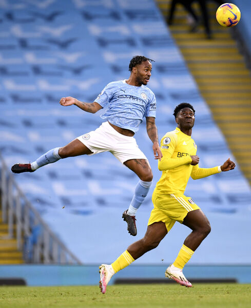 Raheem Sterling of Manchester City (left) and Ola Aina of Fulham fight for the ball.  Image: Peter Powell / PA 