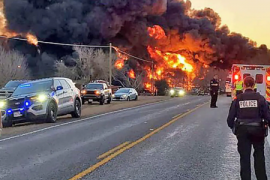 A train carrying gasoline collides with a truck, causing an explosion