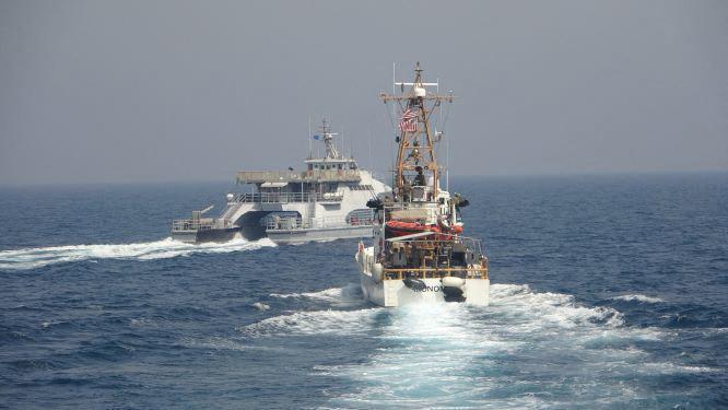 US Navy warning shots on Iranian ships in the Gulf