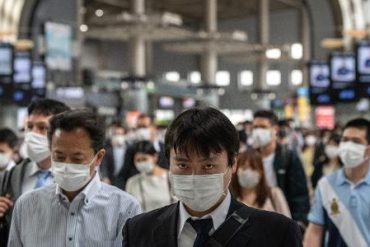 Japan extends virus emergency to 3 municipalities