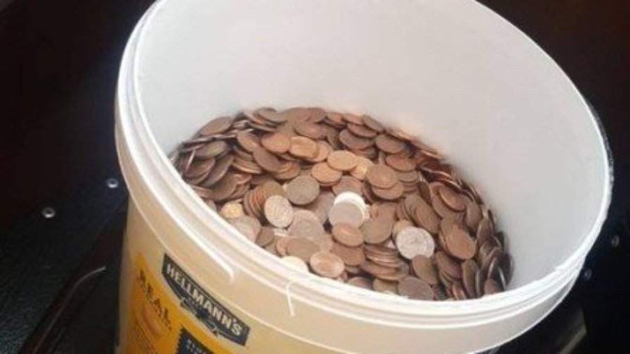 Payment in coins in a bucket of mayonnaise