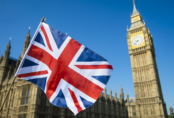 UK flag in front of Westminster Palace 