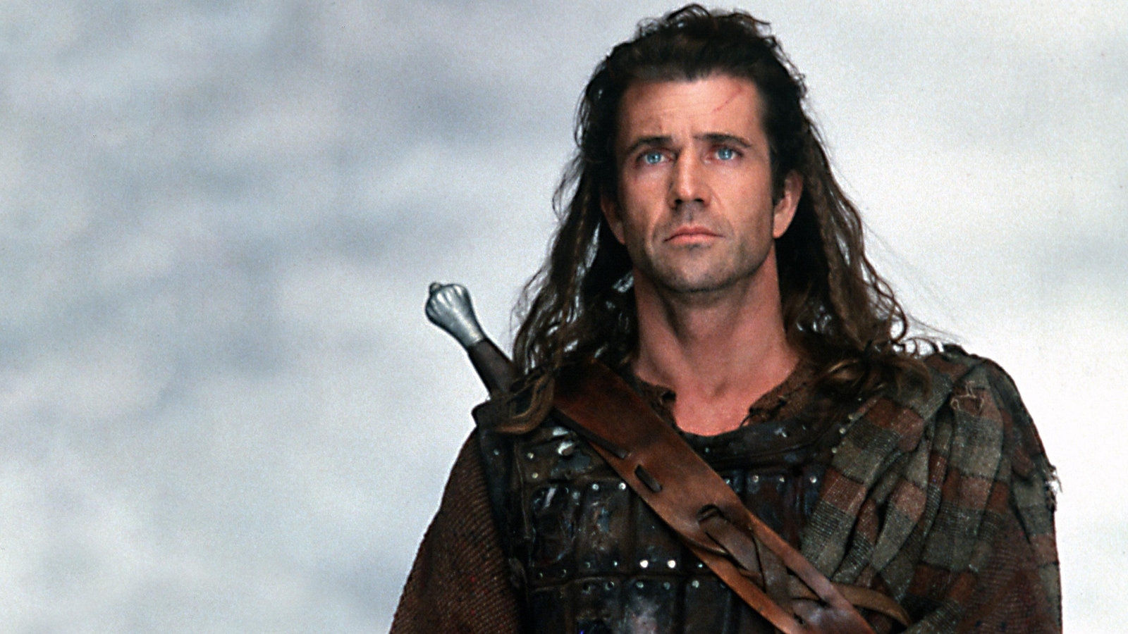 Someone wearing a tartan plaid and sword (Mel Gibson).