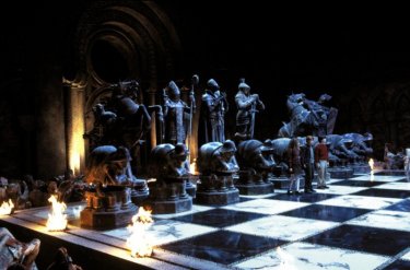 Emma Watson, Rupert Grint and Daniel Radcliffe on a giant chess board in a scene from Harry Potter and the Philosopher's Stone