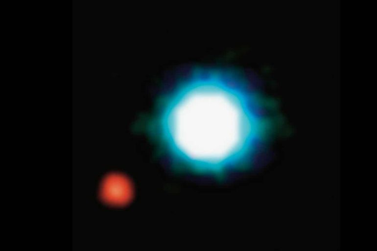 This is the first image of a planet near another star