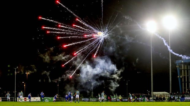 Fans shoot players with fireworks