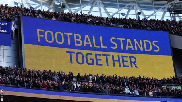 A screen shows "Football stands together" Wembley back Ukraine ahead of Carabao Cup final