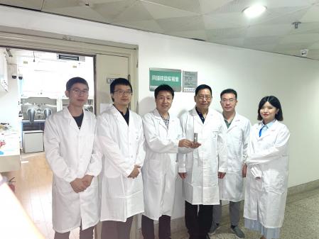 Nanjing University team holds samples of moon soil
