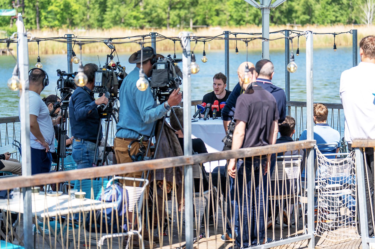 NBA player Jacob Poultel (Spurs) with media representatives