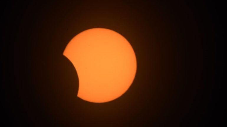 Rare black lunar eclipse strikes the sun in South America