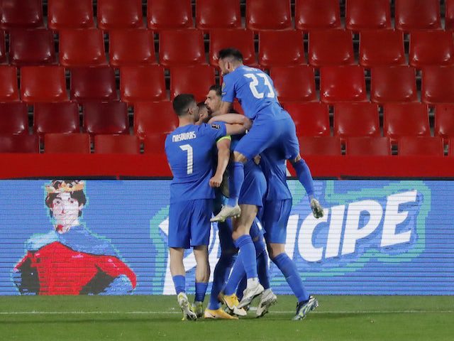 Anastasios Bacasetas of Greece celebrates his first goal with his teammates on March 25, 2021