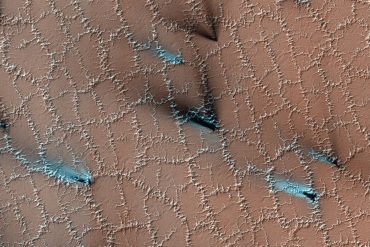 Polygonal structures on the surface of Mars.  You can see them from miles away