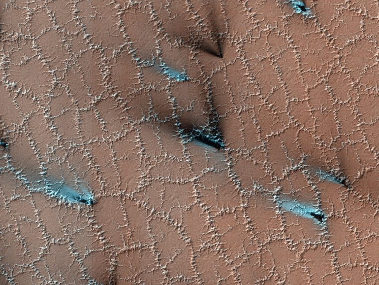 Polygonal structures on the surface of Mars.  You can see them from miles away