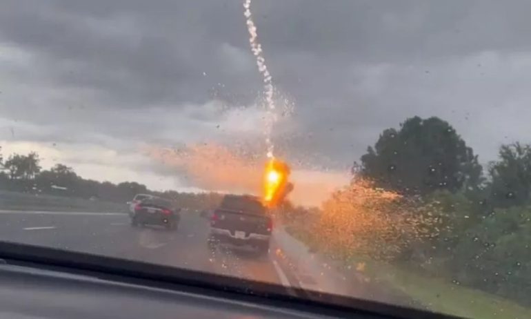 A woman recorded the exact moment her husband's car was struck by lightning in the US