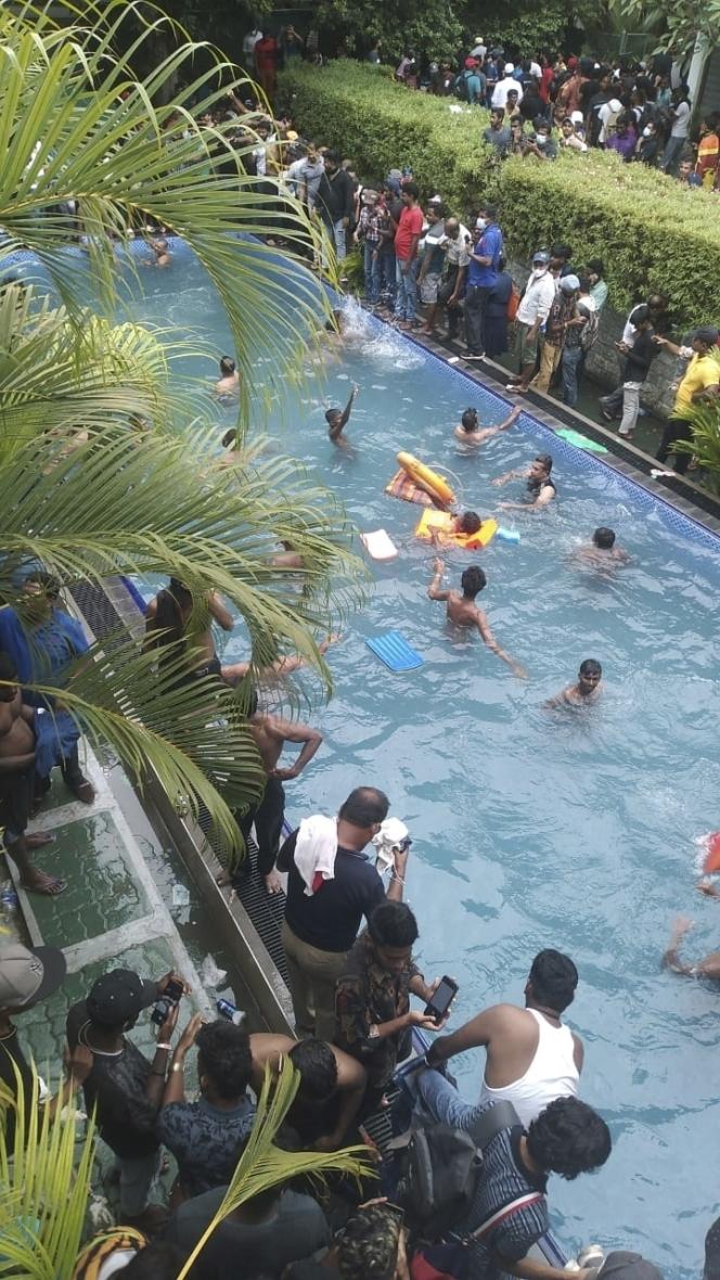 Protesters swim after storming the swimming pool at the president's official residence on July 9, 2022 in Colombo, Sri Lanka.