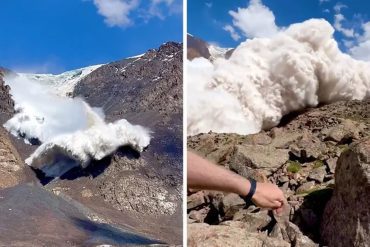 tourist films against the backdrop of snow in the mountains;  Video