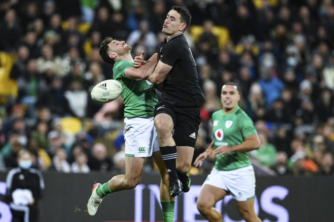 New Zealander Will Jordan hits an Irish player during a meeting between the two selections in Wellington on Saturday 16 July 2022.