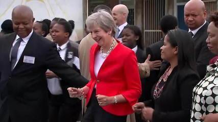 Theresa May dances with children in South Africa and wins the Internet