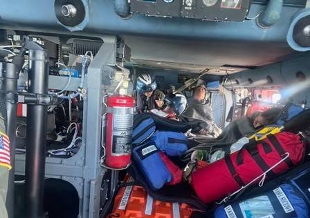 First aid is provided by helicopter to rescuers in the Gulf of Mexico