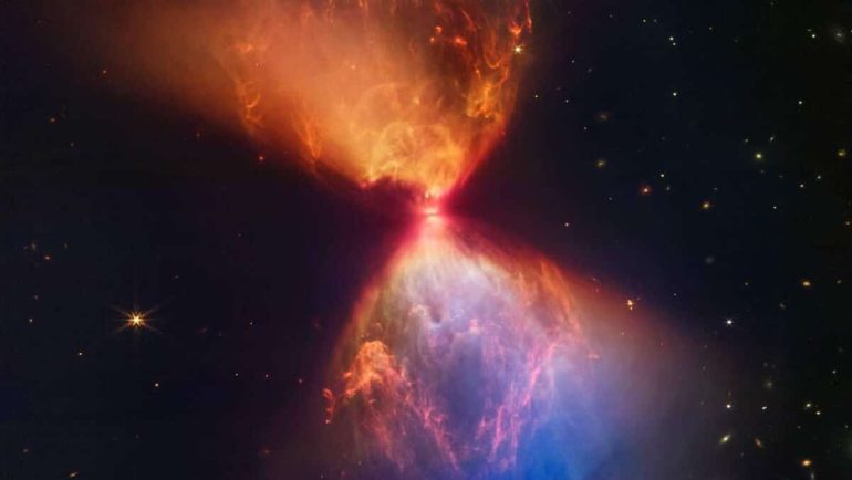 James Webb unveils a magnificent hourglass of dust around a young star